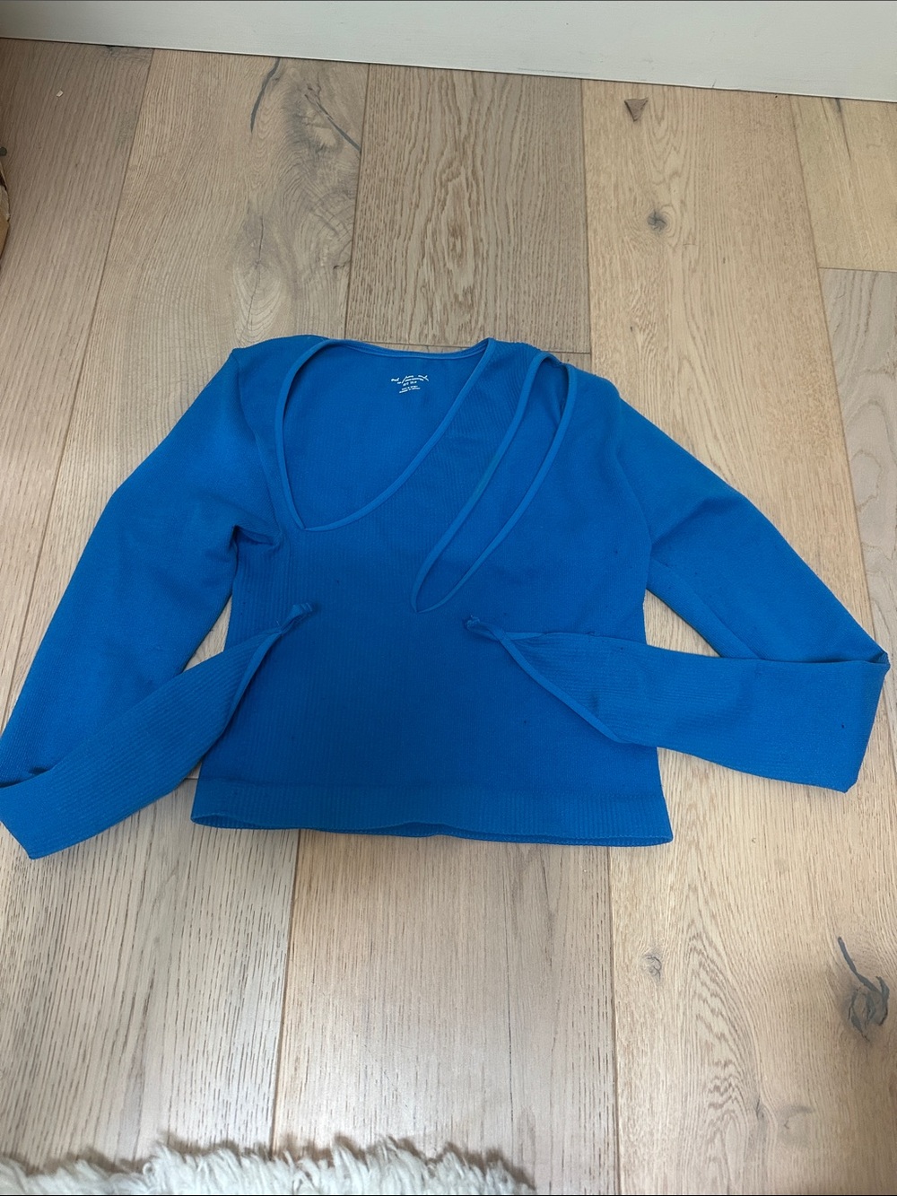 Out from under blue cut out top